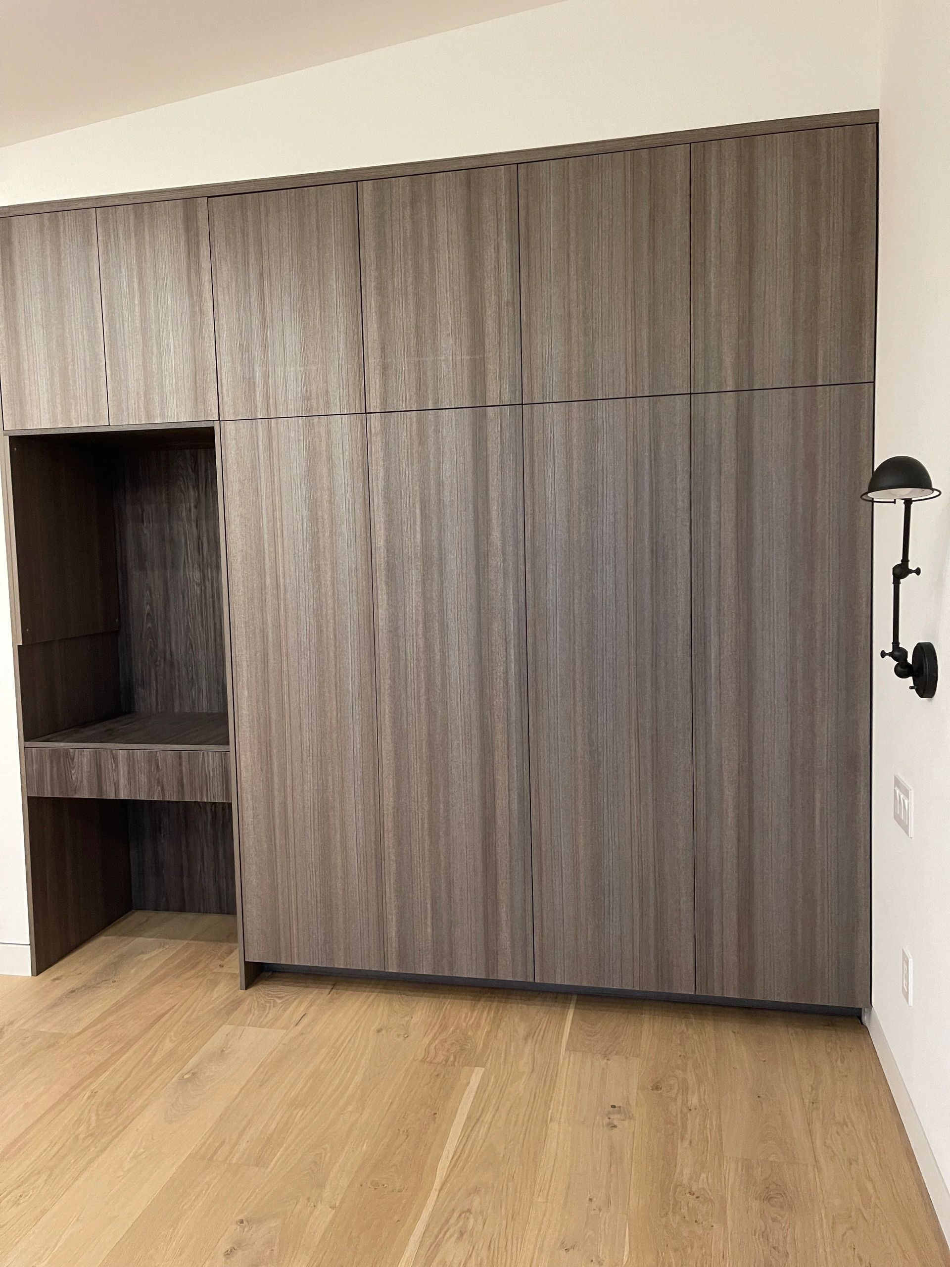 Wardrobe closet system with grey-stained oak panels