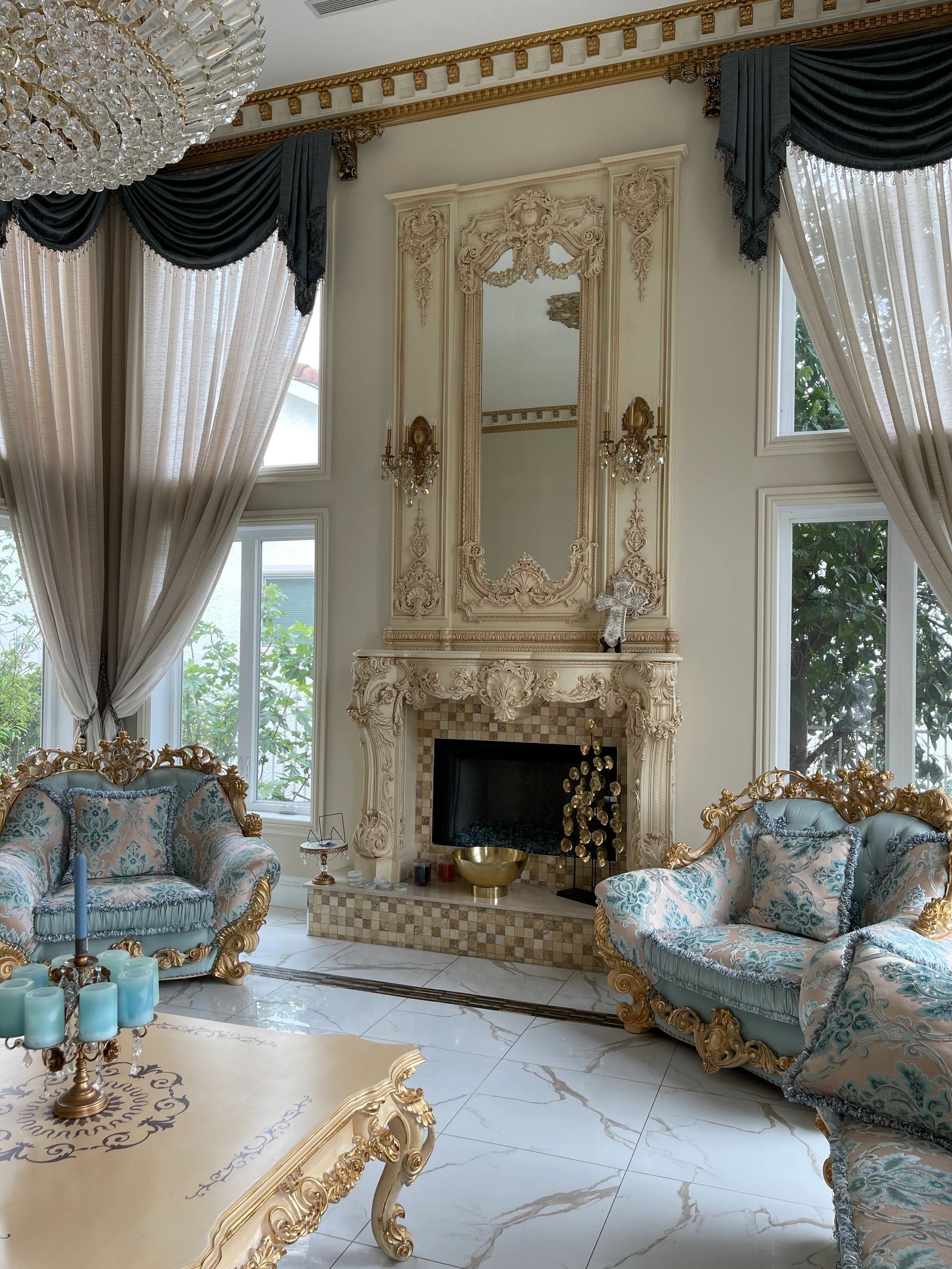 Ornate fireplace surround with carvings, ivory and gold lacquer