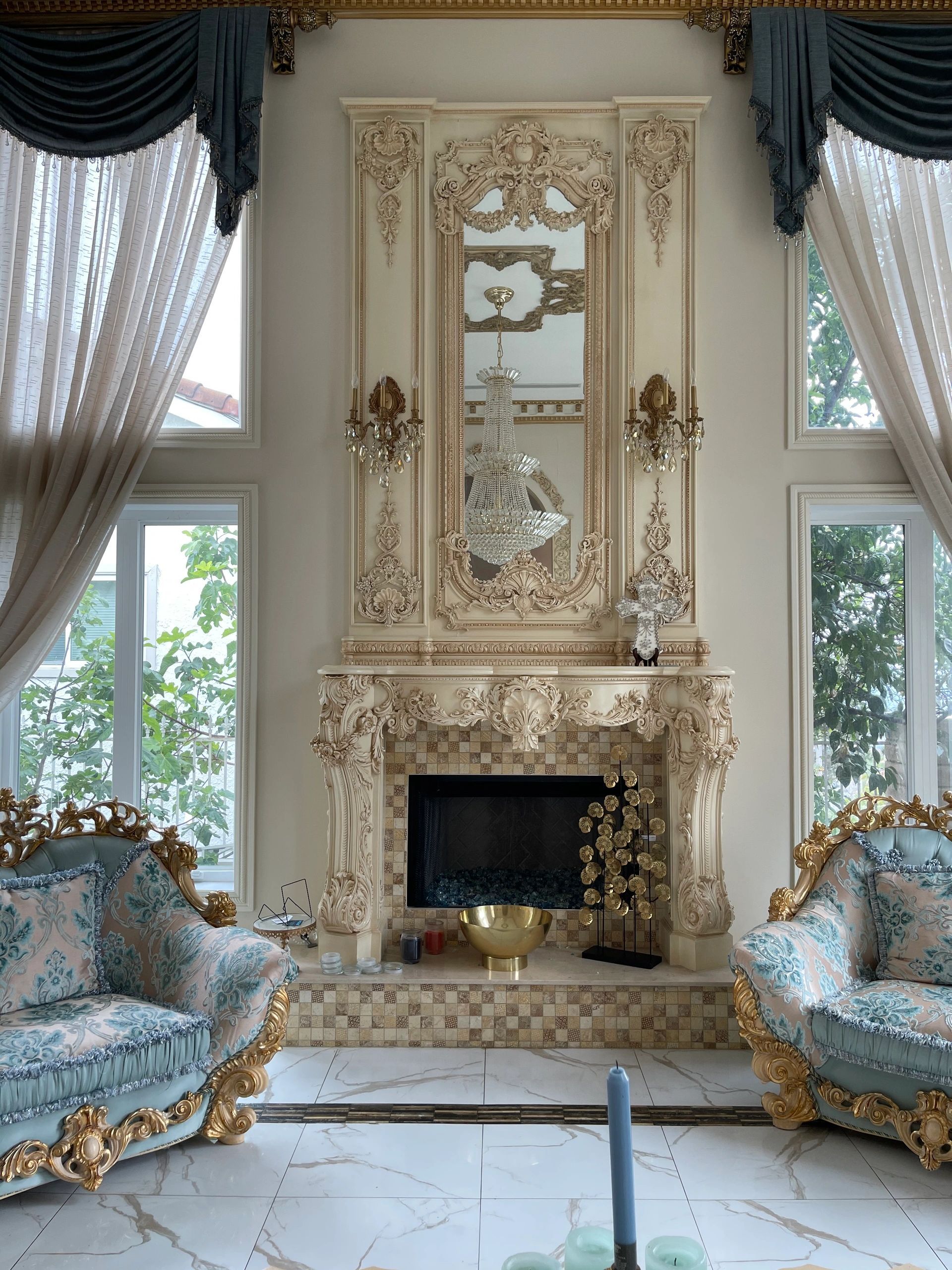 Ornate fireplace surround and mantel, traditional carving details