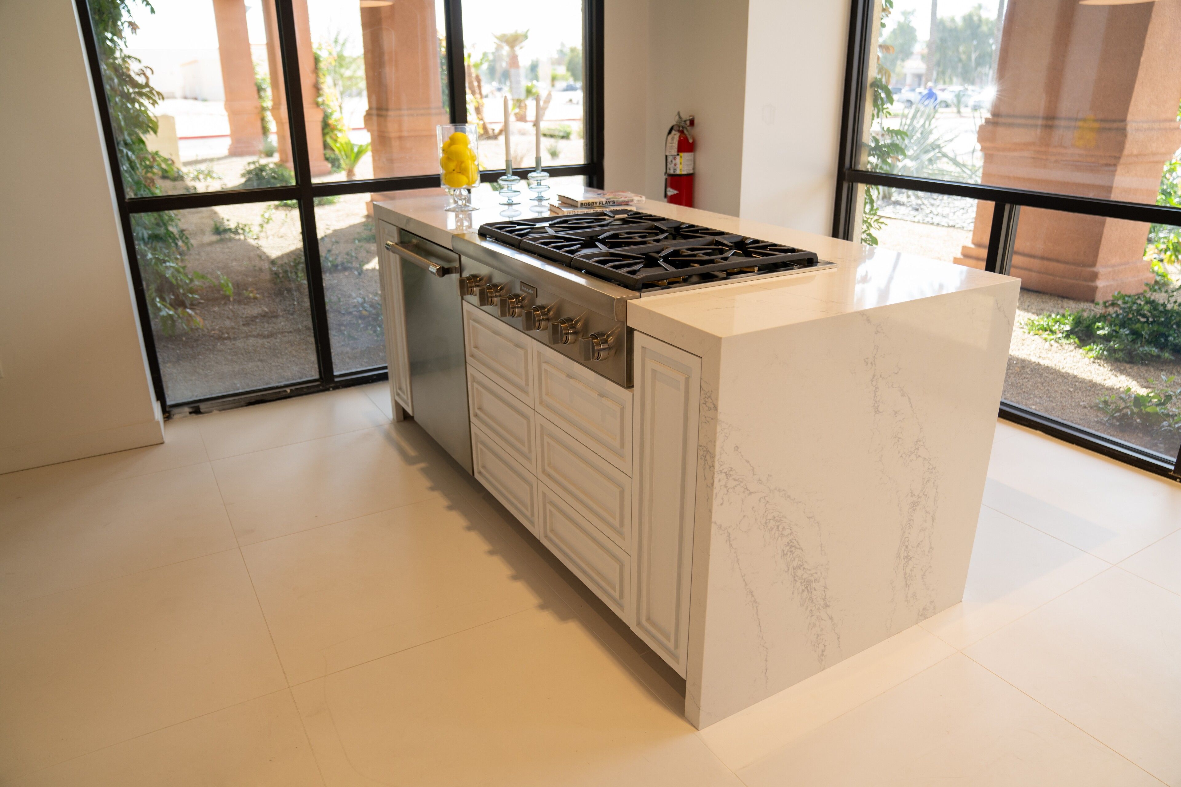 Kitchen islands by NIC Cabinetry - stone waterfall and slab islands
