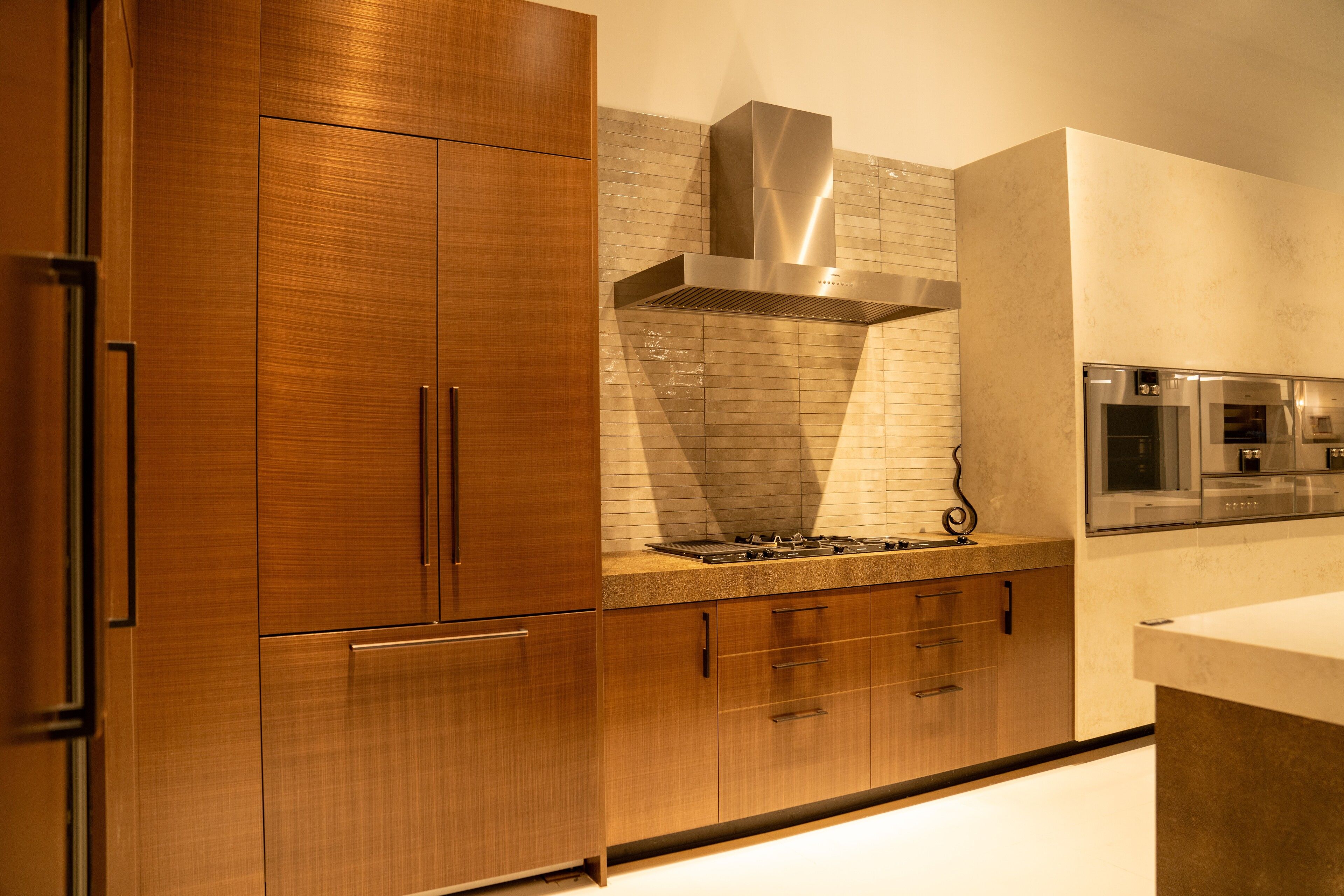 Walnut kitchen with an integrated wine wall