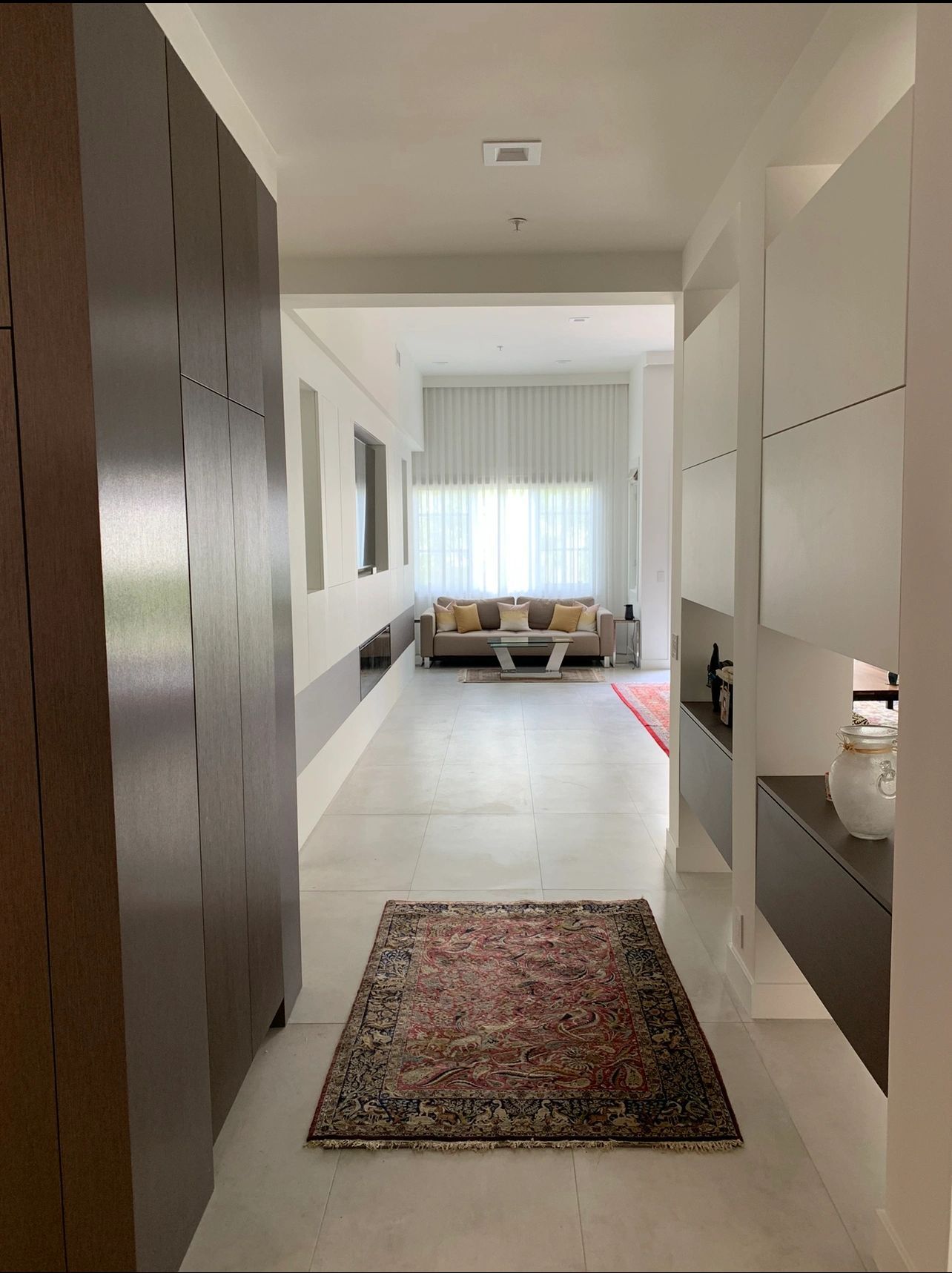 Dark wood slab wardrobe cabinets in a hallway