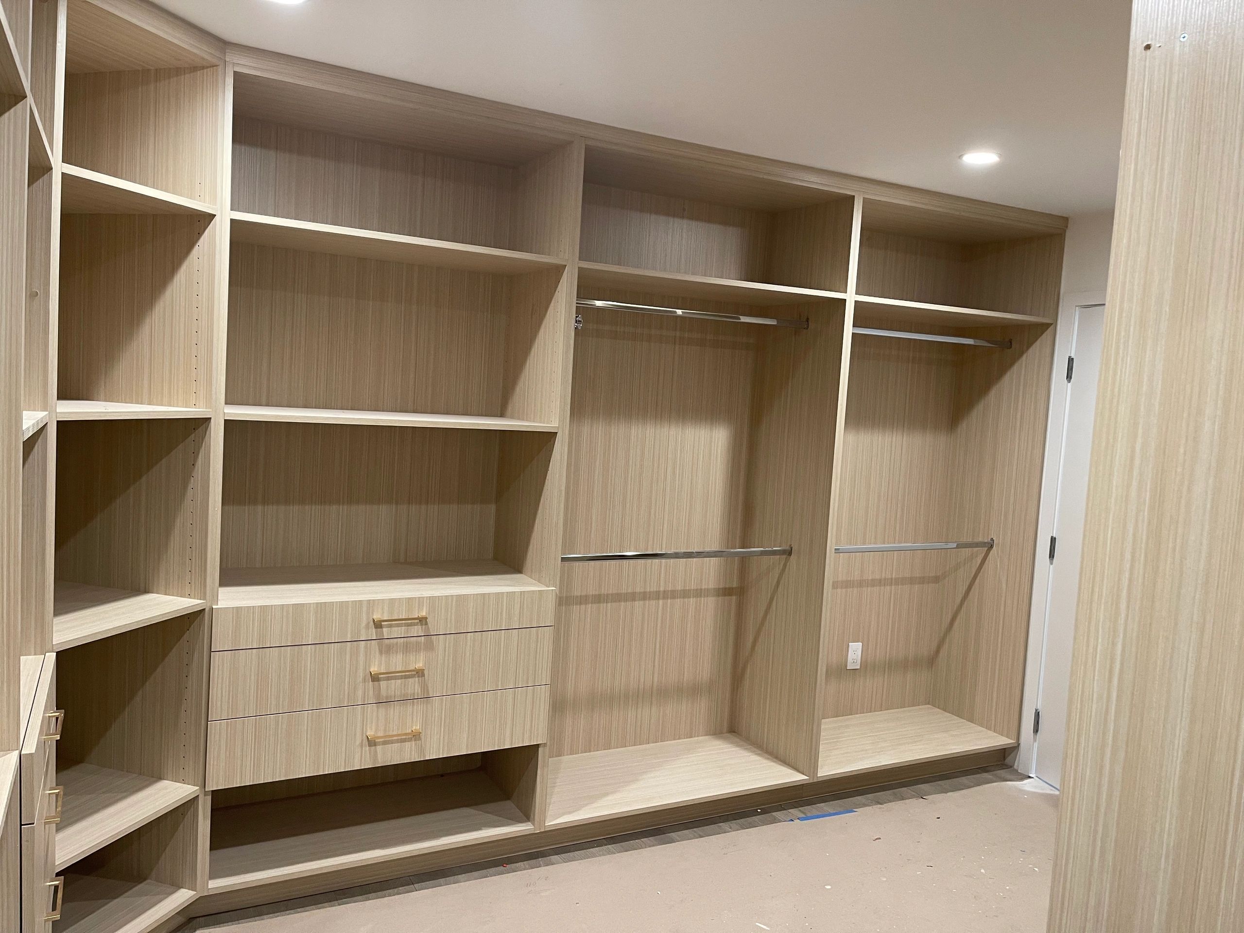 Walk-in closet drawer boxes in white oak
