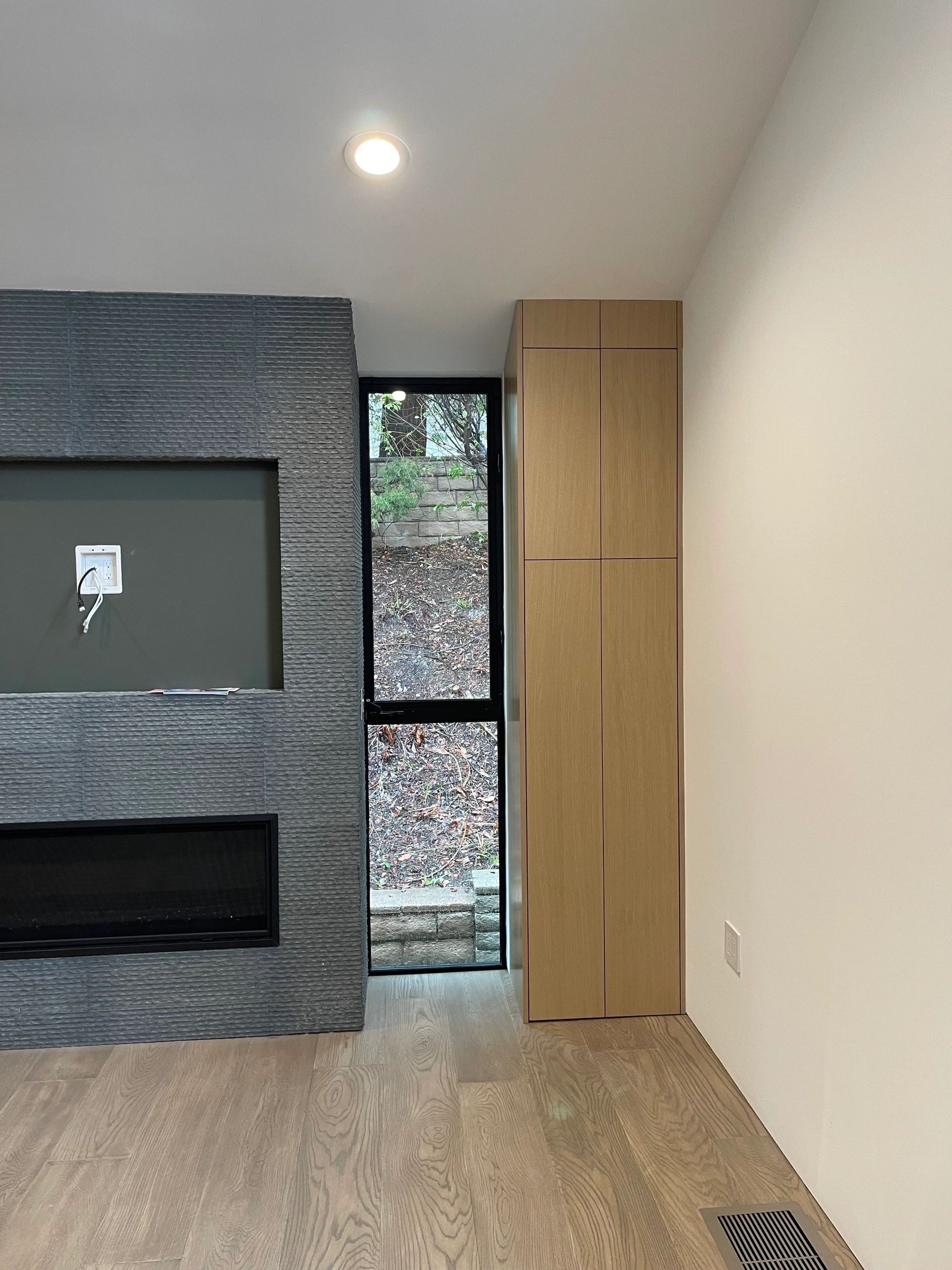 Modern light oak fireplace surround media cabinetry